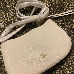 Cream/Ivory Coach pebble leather handbag. Never used, comes with duster bag.